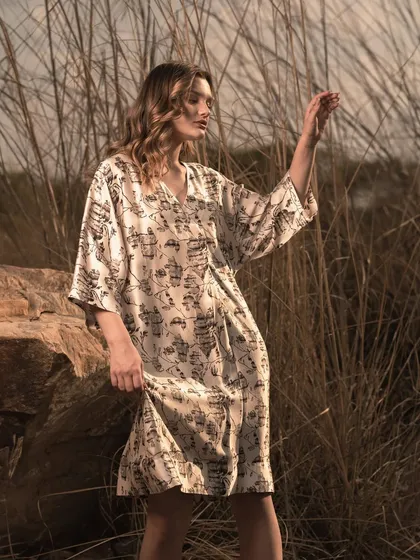 Capturing the model in a moment of interaction with her surroundings. This type of shot adds a narrative element to a lookbook, making the collection feel more alive and aspirational.