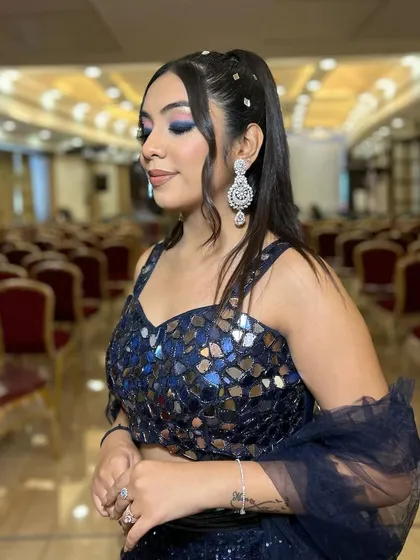 Another angle of this striking blue eye makeup look. It’s a great example of how to play with color for a fun and glamorous event.