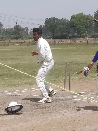 A fielding drill using a helmet on the ground as a target. This improves a fielder's accuracy and ability to hit the stumps directly.