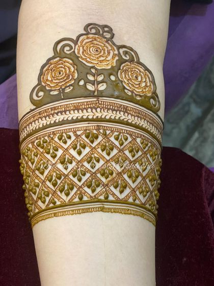 The same rose arm band design, showing the importance of consistent and clean application.