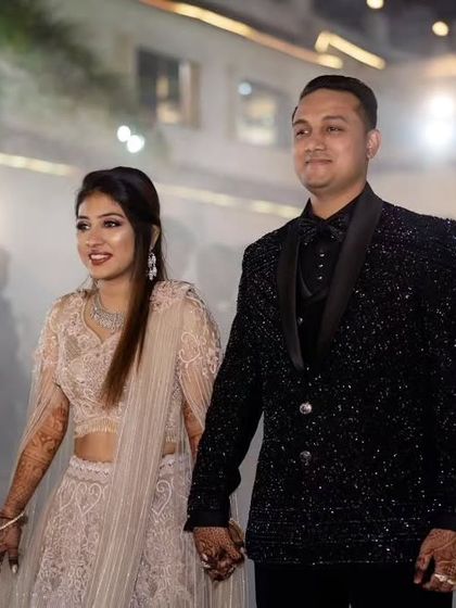 A candid moment from a wedding, showcasing the black katdana work suit. It’s designed to be comfortable enough for the whole celebration while looking impeccable.