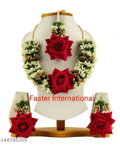 A product shot of a classic Haldi jewellery set featuring red roses and white mogra flowers. This set includes a necklace, earrings, and maang tikka.