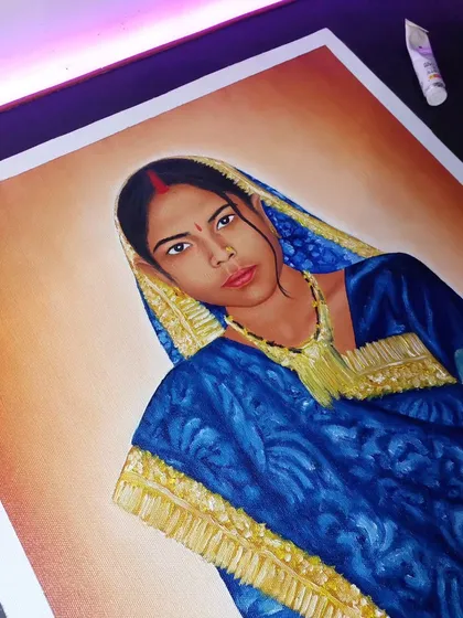 Another angle of the oil portrait of my mother, showing the details in her expression and the vibrant blue of her saree.