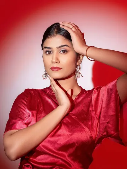 Switching to a bold red outfit and a classic red lip. This look is powerful and confident, perfect for a brand that wants to make a statement.