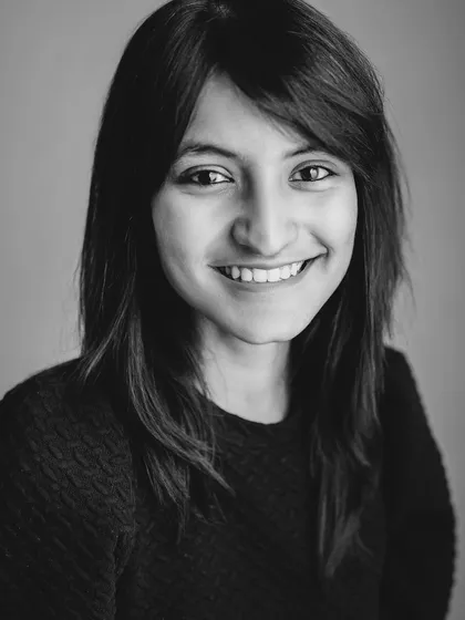 A black and white portrait of me, celebrating my all-women team who are the backbone of the Mommy Shots experience.
