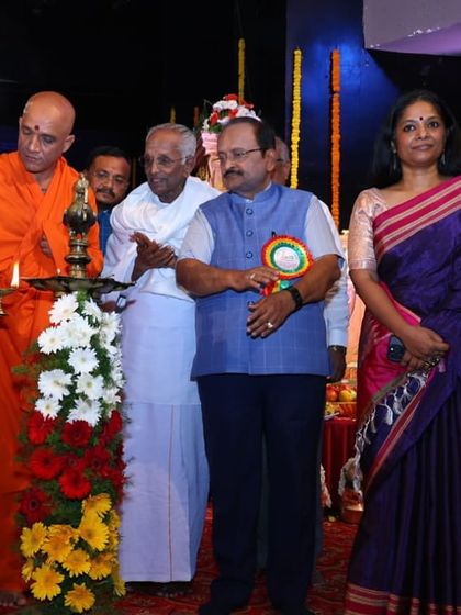 Participating in the lamp lighting ceremony to inaugurate the award function. Such traditions mark the auspicious beginning of an important event.