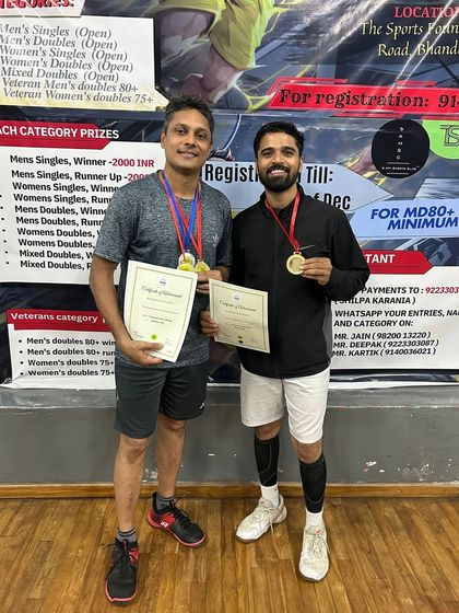Coaches Sushant and Akshay proudly displaying their gold medals. This hands-on experience is what makes our coaching practical and effective.