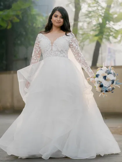 A princess moment for this Catholic bride in her layered white gown. The airbrush makeup provides a flawless, long-lasting base for her special day.