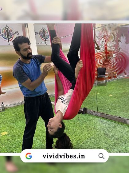 Overcoming fear is a huge part of the journey. This student is learning to trust the hammock and herself with the help of a supportive instructor.