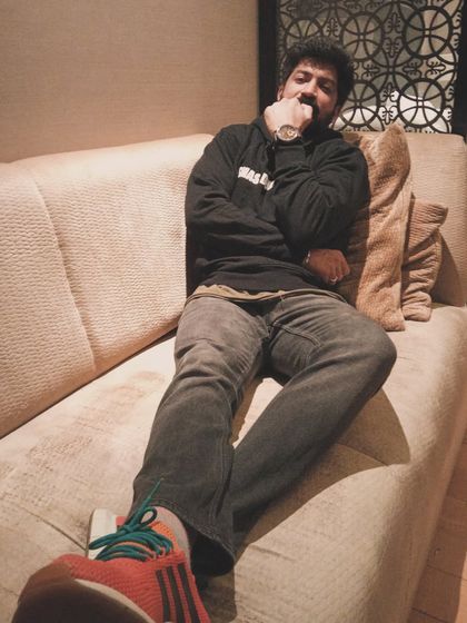 A relaxed pose on the couch. My style is my own, a unique reflection of who I am.