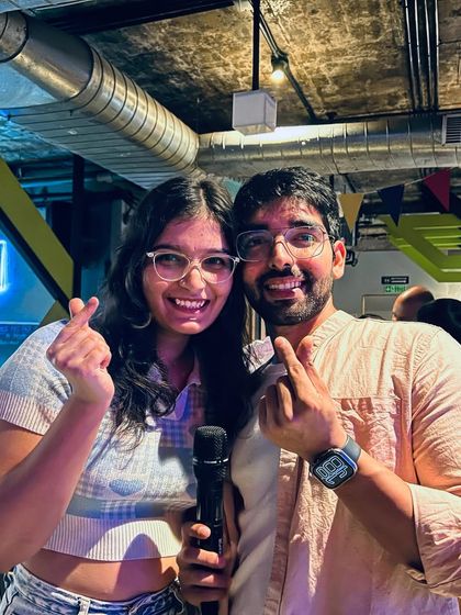 This couple is all smiles after their duet performance. Karaoke is better when you share the spotlight.