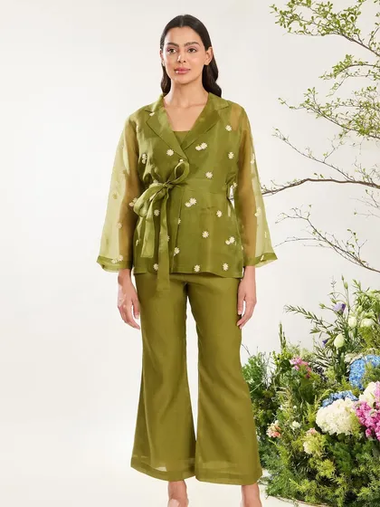 A full view of the olive green organza jacket and trouser set, a perfect example of modern fusion wear.