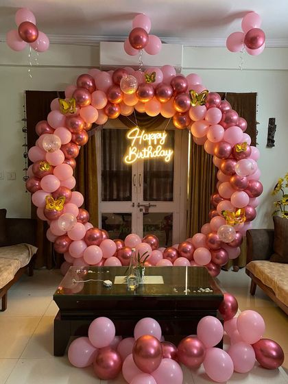 A beautiful shot of the pink and rose gold balloon ring with butterfly accents.