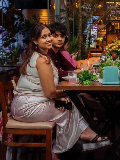 A guest looks on, enjoying the ambiance and the company during our Puffizza 2.0 event.