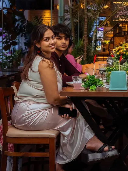 A guest looks on, enjoying the ambiance and the company during our Puffizza 2.0 event.