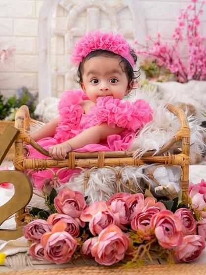 Halfway to one and pretty in pink. This six-month milestone session in a beautiful floral setting is a perfect way to capture this adorable stage.