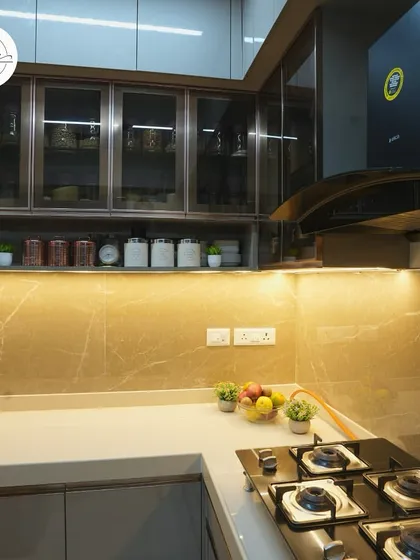 A close-up of the hob and the organized spice rack in this modern kitchen.