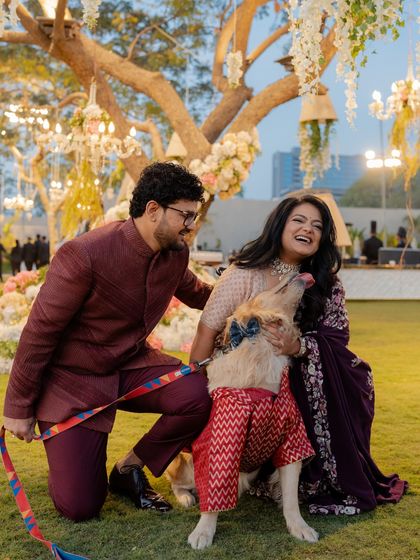 A pre-wedding reception look that's all about joy, featuring the couple and their adorable dog, who also got a custom-styled outfit.