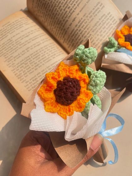 Another angle of the mini sunflower bouquet, showing the detail of the petals and the rustic wrapping.