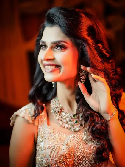 A beautiful, happy portrait of the bride at her reception.