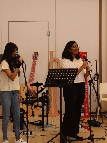 A vocal duet between two students at the Museum of Solutions. Learning with a friend can make the journey even more fun and we encourage these collaborations.