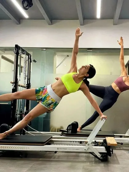 Pilates is even more fun with a partner. Here, Sara Ali Khan and I perform the 'Star' on the Reformer, a challenging exercise that requires synchronization, core strength, and trust. It’s a great example of how we can make workouts both demanding and enjoyable.