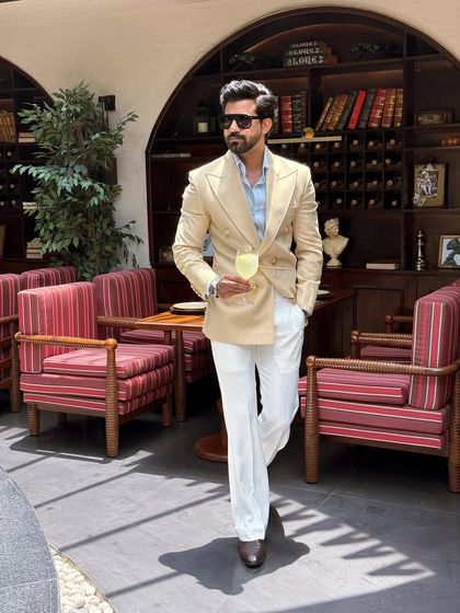 Walking with confidence in a bespoke double-breasted suit tailored by us.