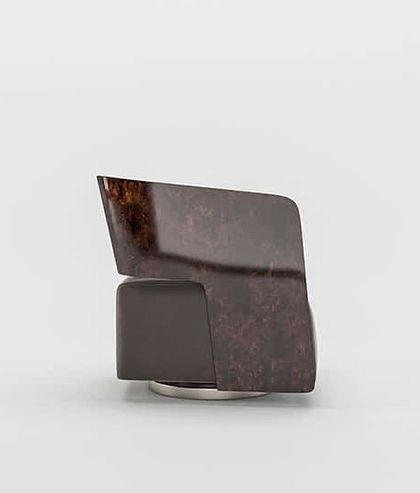 A side view of the Levi Armchair, highlighting the dramatic sweep of the polished wood panel that wraps around the back.