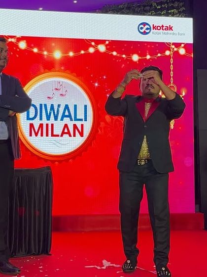 Performing a classic money trick on stage at a Kotak Diwali Milan event. It's a great illusion that gets the whole corporate audience wondering and laughing.