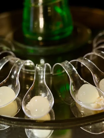This is my litchi molecular dessert. The small, translucent spheres pop in your mouth to release a burst of sweet litchi juice, a fun and innovative dessert that always surprises and delights guests.