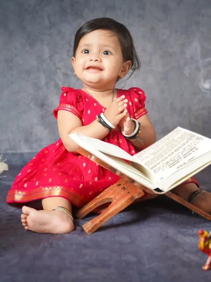 A moment of prayer and gratitude. This beautiful shot captures a serene moment from our Sanskrit Day theme.