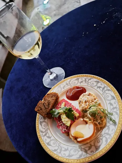 Enjoying the wine and canapés at the art exhibition. The culinary experience was as curated as the art on display.