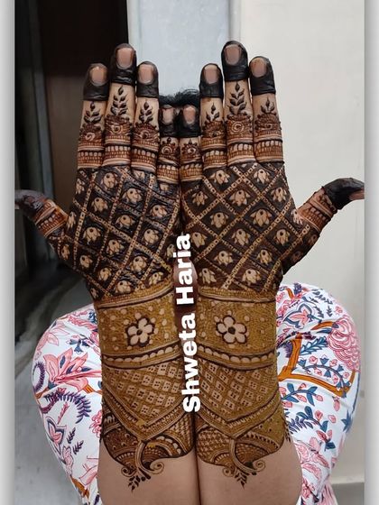 A unique back-hand design featuring a 'bandhani' inspired pattern with floral bands on the wrist.