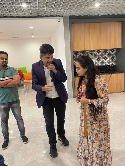 Explaining the rules to a participant before we begin. Clear instructions are key to making sure the games run smoothly and everyone has fun.