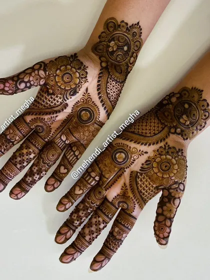 A playful and modern design with asymmetrical patterns on each hand, combining mandalas, hearts, and floral elements.