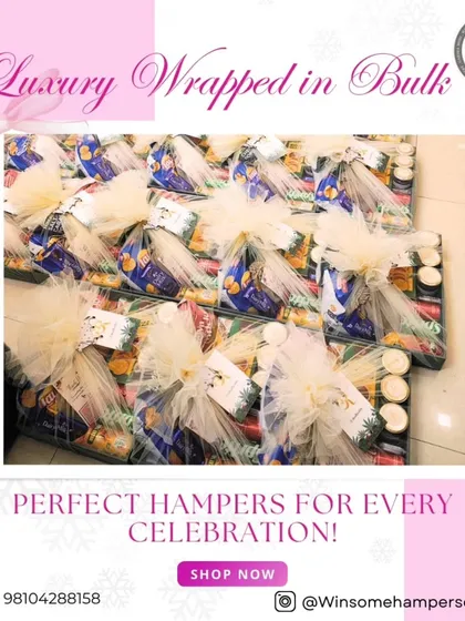 Luxury wrapped in bulk. This image shows multiple trays of hampers being prepared for a large celebration, each meticulously wrapped in netting with a beautiful bow, ready for delivery.