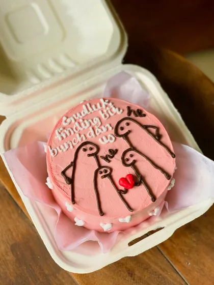 A funny and sweet cake for a couple, featuring a family of meme characters with the Hindi text "Gudluck finding bunchdan us," a playful take on finding a better match.