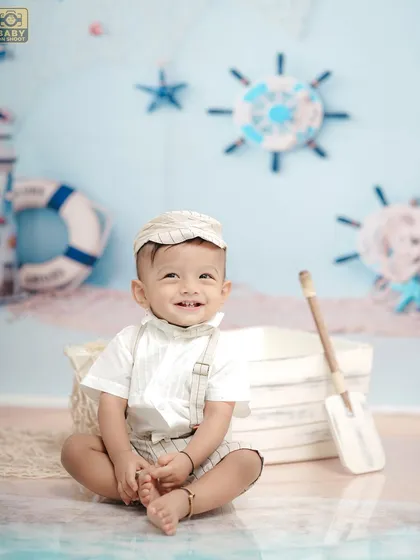 A happy little sailor enjoying his sea adventure. The light and airy color palette gives this theme a fresh, cheerful feel.