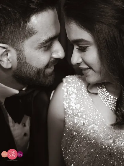 The same glamorous close-up in black and white. This version emphasizes the emotion and connection, creating a timeless, classic feel.