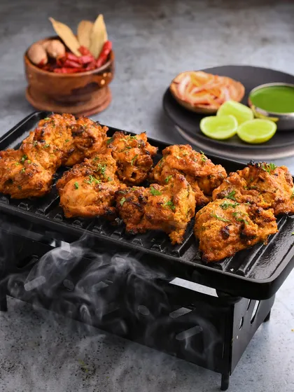 A smoky, sizzling shot of Bhatti ka Murgh for Bombay Diner. We used a mini grill and smoke to create a dramatic effect that highlights the tandoori style of the dish.
