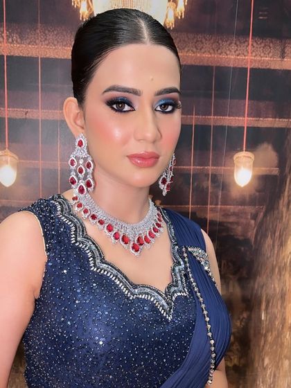 Another angle of this captivating blue eye makeup. The rich color and precise blending create a look that is perfect for any bride or guest wanting to make a statement at a cocktail or reception event.