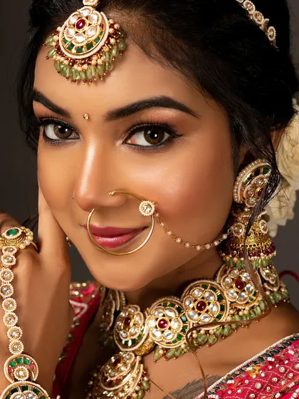 A close-up from a bridal portfolio shoot, focusing on the flawless makeup and intricate Kundan jewellery. I use lighting that makes the skin glow and brings out the richness of the traditional look.