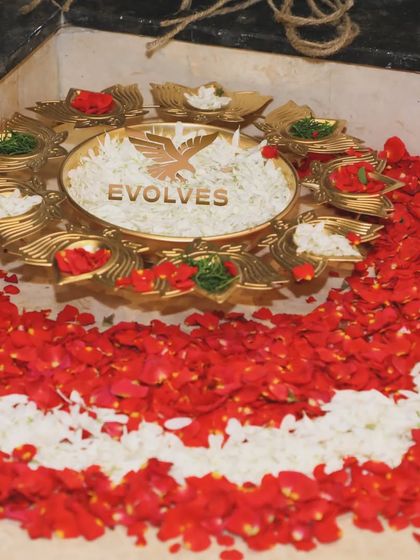A decorative floral arrangement on the floor, featuring our company logo. This adds a personalized and branded touch to the event decor.