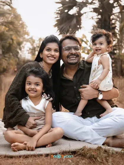 Family portraits are for everyone. Here is a beautiful family of four, including an older sibling, celebrating a first birthday.