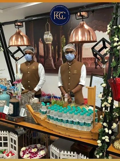 A custom bar setup designed for a special event. Featuring a boat-shaped ice basin for water bottles and a charming picket fence detail, this shows our ability to create unique, themed stations.
