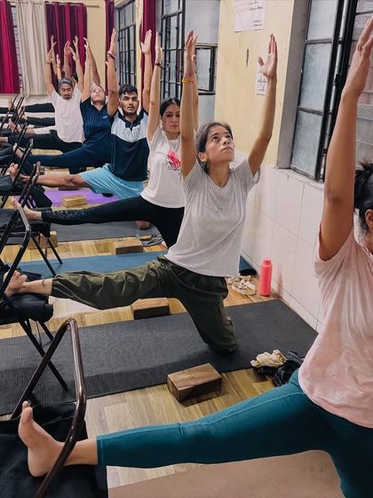 This is a supported warrior pose variation using chairs. This helps students to hold the pose for longer and work on their alignment and strength.