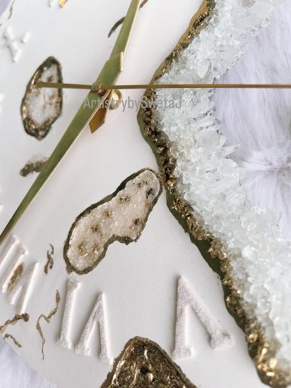 A close-up of my geode fusion clock, showing the sparkling clear crystals and gold accents against the premium white gypsum base.