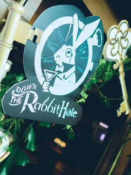 We love bringing a story to life. For this milestone celebration, we invited guests "Down the Rabbit Hole" with custom signage and props, setting the stage for a whimsical Alice in Wonderland themed brunch.