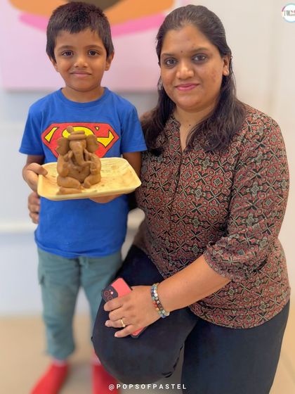 A proud mother and son pose with their handcrafted clay Ganesha, a wonderful memory and a beautiful idol to take home.