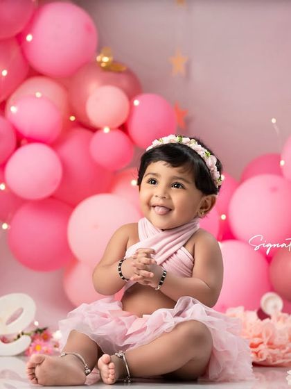 The perfect smile. This first birthday portrait is a beautiful keepsake of a very special milestone.